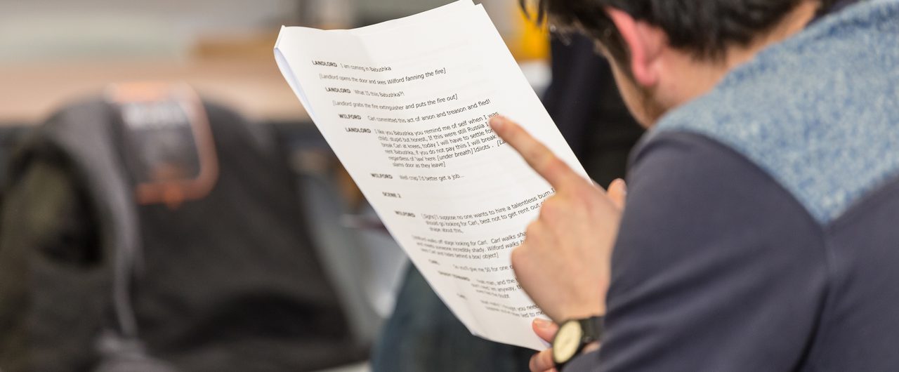 Actor reading a script.